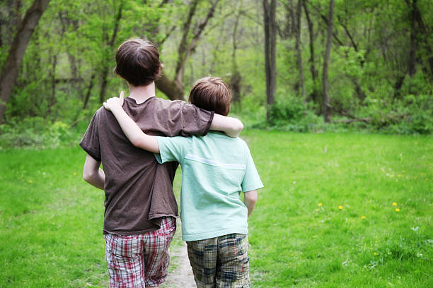 istock Little Boys Walking Along Path in Wooded Green Park 171108863