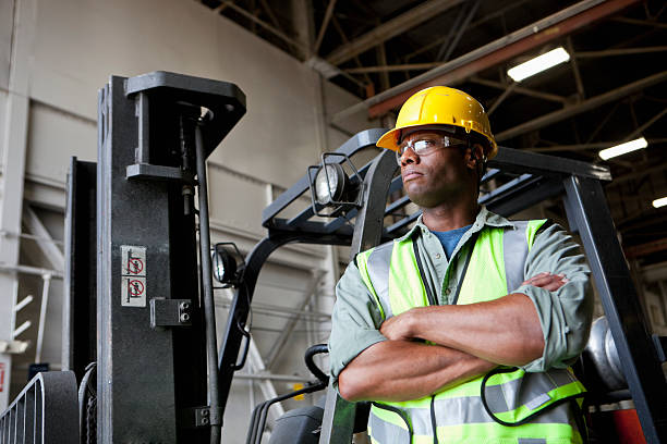 istock African American worker standing beside forklift 171108910