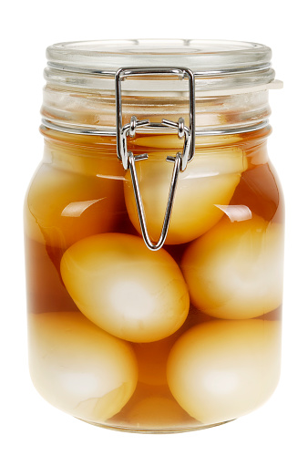 Jar of home pickled free range eggs in malt vinegar.http://www.djwhite.co.uk/photog/headers/food_tle.jpg