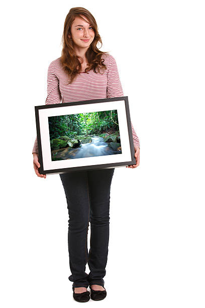 istock Girl Holding Photo Frame 171109792