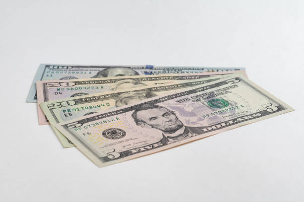 istock 5, 20, 50, 100 dollars banknotes at different angles. Close up of dollars on white background. 1711098497