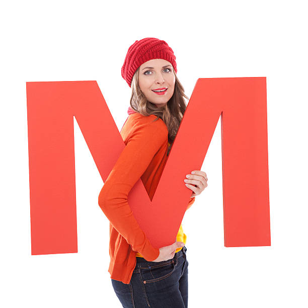 istock Woman holding letter M. 171110096