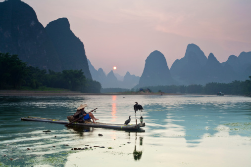 Tourist cruise boat sailing around islands at Halong Bay, Vietnam