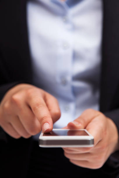 istock businesswoman touching smart phone screen 171110546
