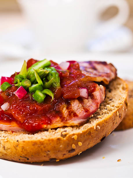 istock Bagel with salsa, asparagus, radish, and grilled bacon. 171110550