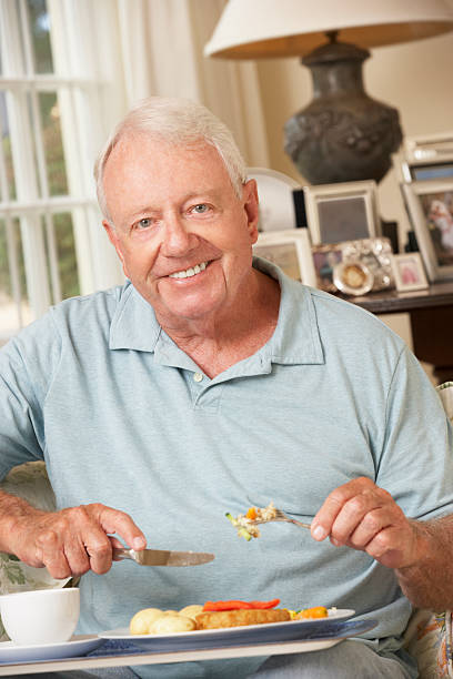 istock Senior Man Enjoying Meal At Home 171110818