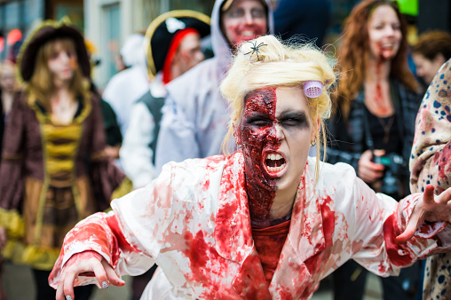 Toronto, Canada - October 22, 2011: People dressed as zombies roaming the streets in the annual Toronto Zombie Walk.