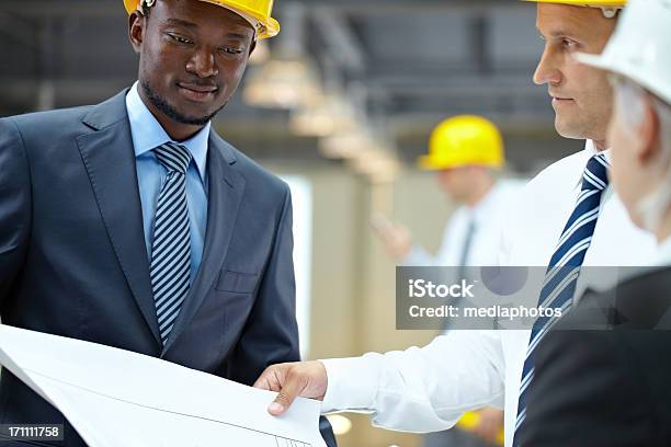 Architectures With Paperwork Stock Photo - Download Image Now - 20-24 Years, 40-44 Years, Adult