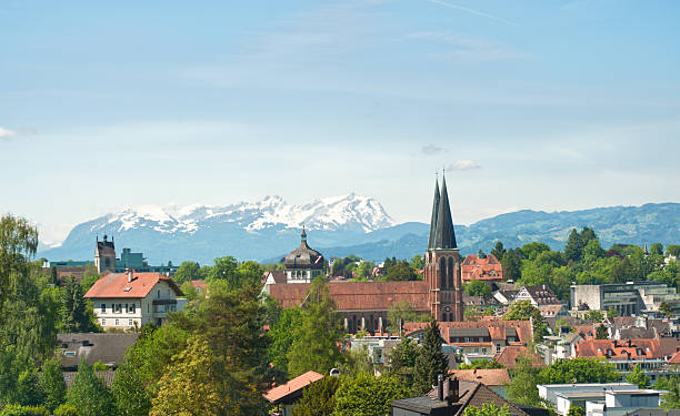 church of Bregenz / Austria and mountain Santis church of Bregenz / Austria and mountain Santis in the background. The Santis is 2500m high bregenz stock pictures, royalty-free photos & images