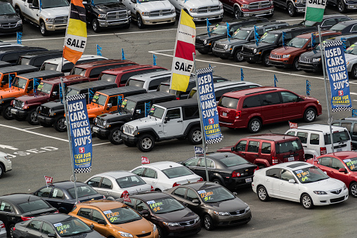 Halifax, Canada - May 15, 2012: Looking down onto a car dealership located on the Bedford Highway featuring a wide variety of vehicles ranging from Mazda compact sedans to Dodge pickup trucks.