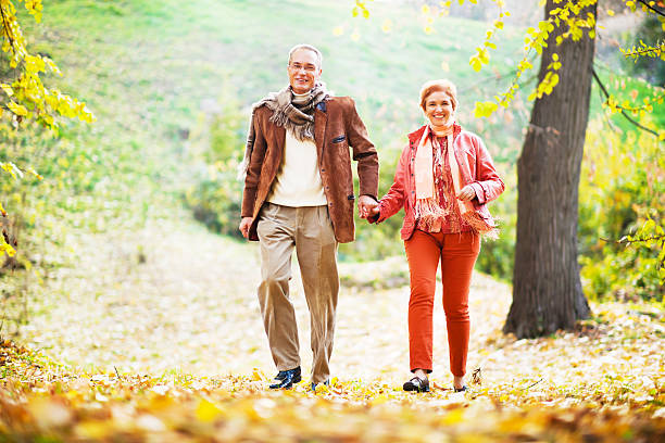 istock Beautiful mature couple walking in park. 171113566