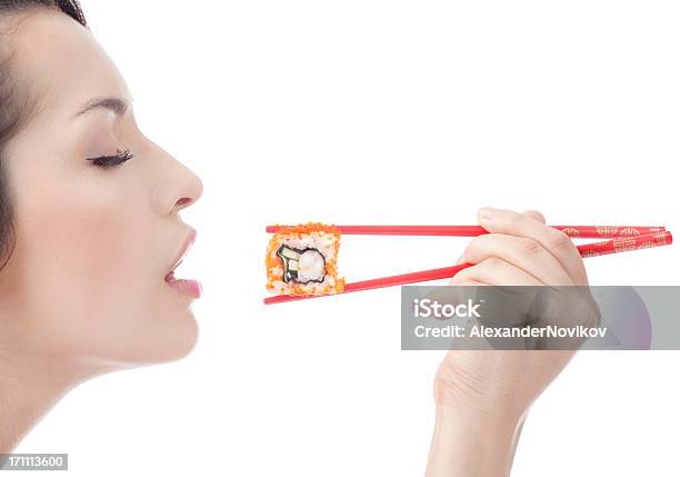 Genießen Sie Sushi Mit Red Chopsticks Stockfoto und mehr Bilder von Sushi - Sushi, Weißer Hintergrund, Eine Frau allein