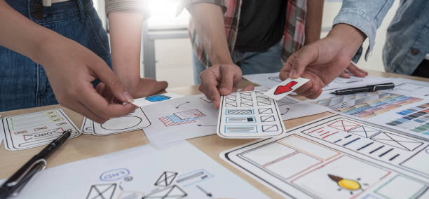 istock A smart and handsome young Asian male website developer is talking and planning a new project with a female colleague in the office. UI, UX, Tech Startup 1711136144