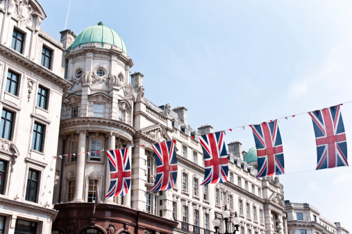 London, United Kingdom – May 27, 2023: A collection of British flags flying proudly outside the Admiralty Arch in London