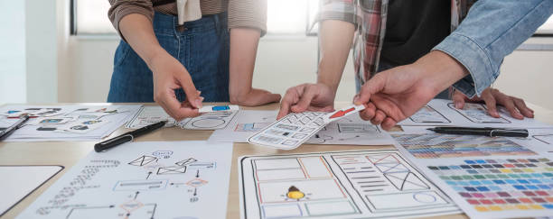 istock A smart and handsome young Asian male website developer is talking and planning a new project with a female colleague in the office. UI, UX, Tech Startup 1711137806