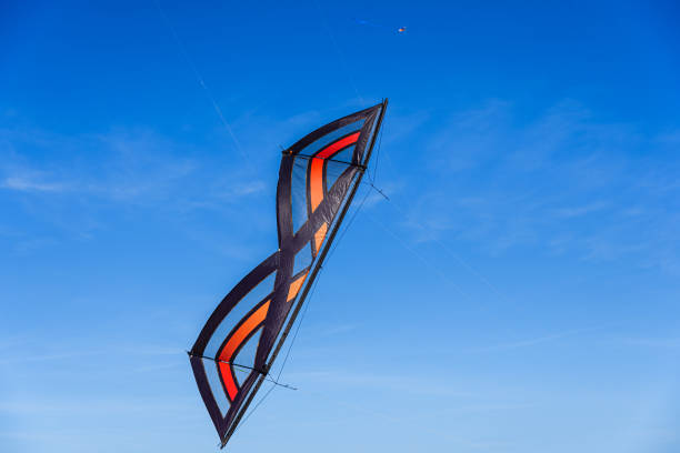 istock Acrobatic Stunt kite flying in the blue sky. 1711140331