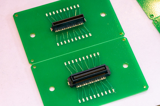 The printed circuit board is green in close-up