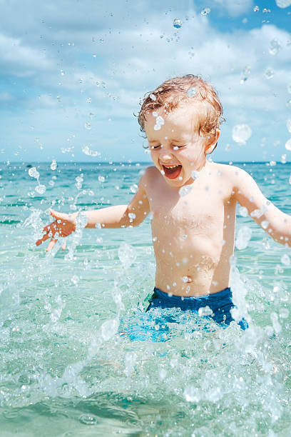 istock Happy boy enjoying water in the sea 171114295