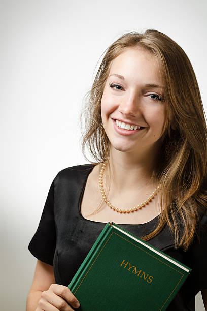 istock Pretty Female Holding a Hymn Book 171114305