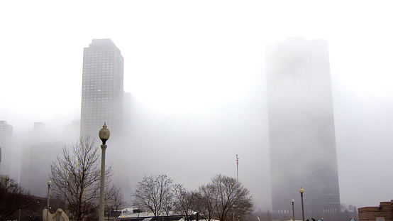 Chicago, Illinois, United States - Dec 12, 2015: Downtown Chicago skyscrapers in the fog on an overcast winter day.
