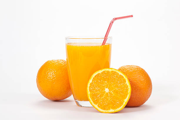 Glass of orange juice and three oranges over white backdrop orange juice isolated on white Glass of Orange Juice stock pictures, royalty-free photos & images