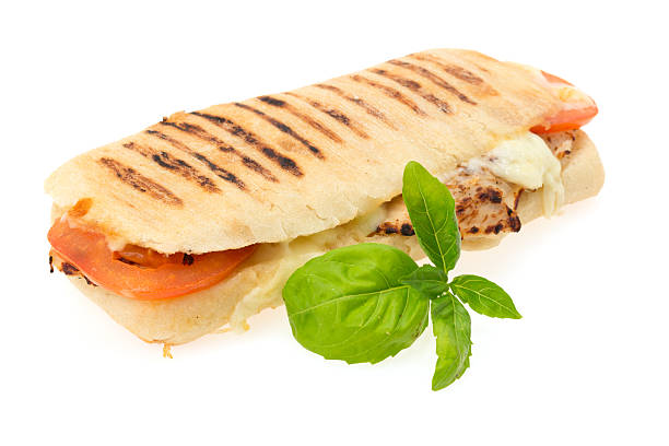 Grilled chicken Panini sandwich Grilled chicken, tomato and mozzarella cheese Panini sandwich - studio shot with a white background panino stock pictures, royalty-free photos & images