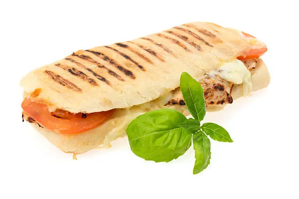 Grilled chicken, tomato and mozzarella cheese Panini sandwich - studio shot with a white background