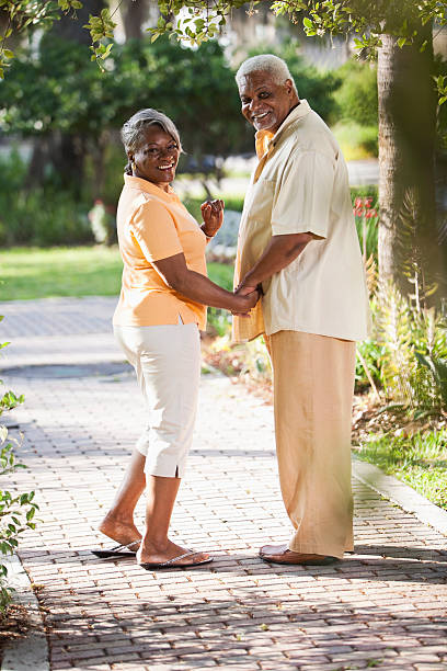 Senior African American couple holding hands