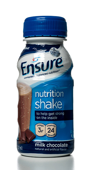 Miami, USA - May 9, 2012: Ensure Milk Chocolate Nutrition Shake 8 FL OZ bottle. Ensure brand is owned by Abbott Laboratories.