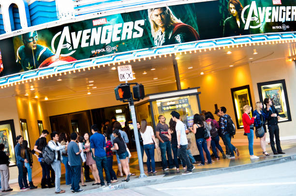 The Avengers Screening at Bruin Theater Los Angeles, California, USA - May 10, 2012: Young people, mostly students from the nearby UCLA, in line at the Bruin Theater entrance in Westwood Village to buy tickets for the evening screening of The Avengers. The 3D film has been produced by Marvel Studios and is distributed by Walt Disney Pictures. box office photos stock pictures, royalty-free photos & images