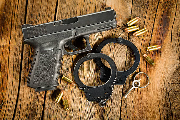 istock Pistol and Handcuffs 171116222