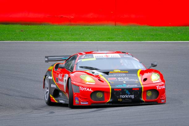 Ferrari F430 GT race car Spa, Belgium - July 31, 2010: AF Corse Ferrari F430 racing on the track of Spa Francorchamps during the 2010 24 hours of Spa. ferrari ferrari f430 italian culture action stock pictures, royalty-free photos & images