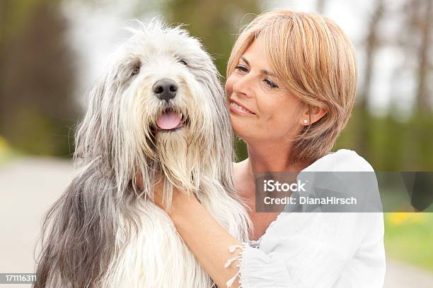 Lovely Hug Between Woman And Her Dog Stock Photo - Download Image Now - Bearded Collie, Dog, Old English Sheepdog