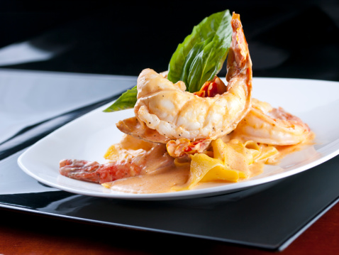 Selective-focus image of Lobster Pappardelle (pasta) with Shrimp