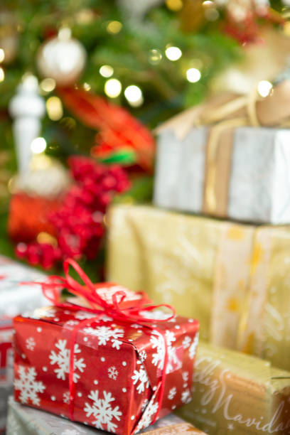 istock Christmas tree surrounded with gifts 1711165420