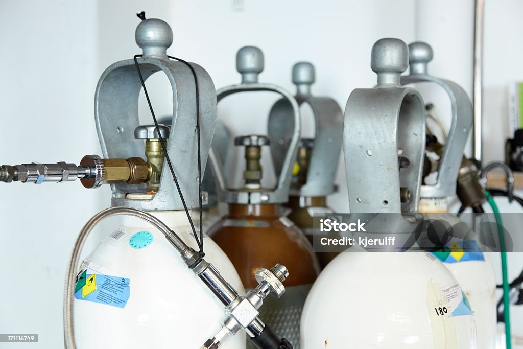 Oxygen and Helium for technical scuba diving Oxygen and Helium bottles used to mix technical diving gases with a decanting hose (fill whip). Technology Stock Photo