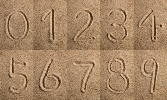 0-1-2-3-4-5-6-7-8-9 sand letters.