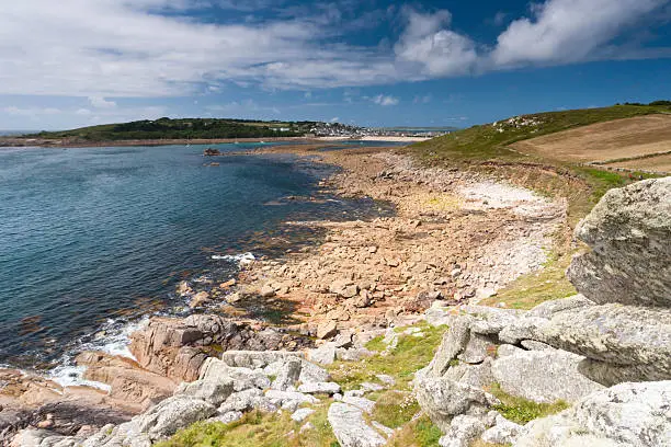 Taken in summer showing part of the lovely coastline of the Scilly Isles. In the distance is the town in St Mary's.