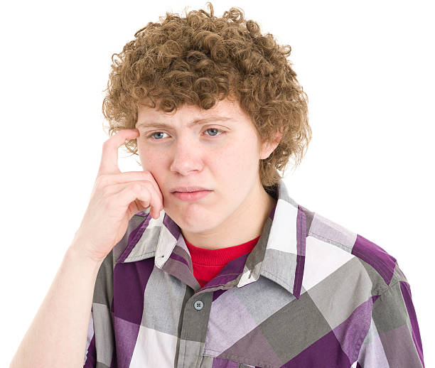 istock Thinking Teenage Boy Scratches Head 171117119