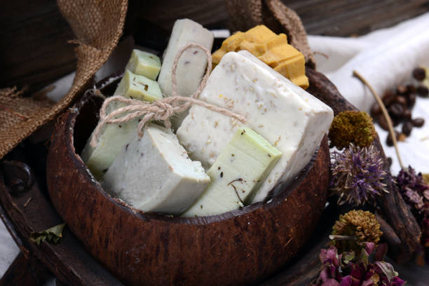 Handmade Soap with bath and spa accessories. White soap composition in coconut bowl. High quality photo