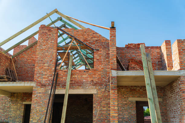 istock Construction of a house. Construction of a red brick house. Modern construction 1711206451