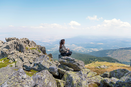 Woman standing in the mountain above the city of Sofia