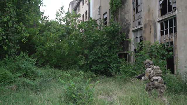 Soldier in civil war, ruined building.