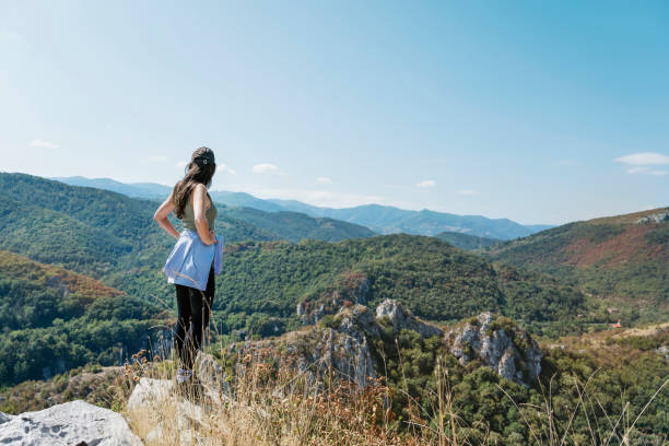 istock Woman standing in the mountain 1711235929