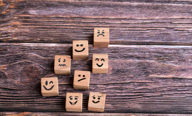 istock Wooden cubes with different emotions  . Empathy Concept 1711249051