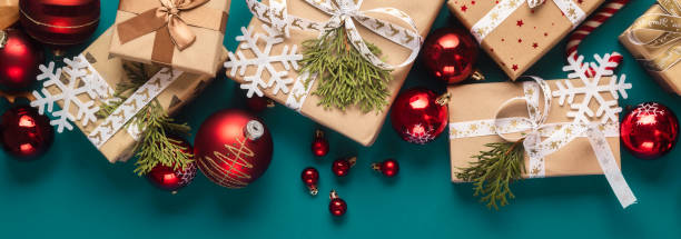 istock Gift boxes with bows and Christmas red balls top view 1711259553