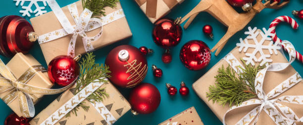 istock Gift boxes with bows and Christmas red balls top view 1711260067