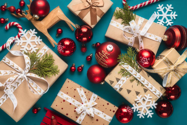 istock Gift boxes with bows and Christmas red balls top view 1711260068