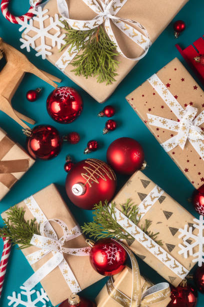 Gift boxes with bows and Christmas red balls top view