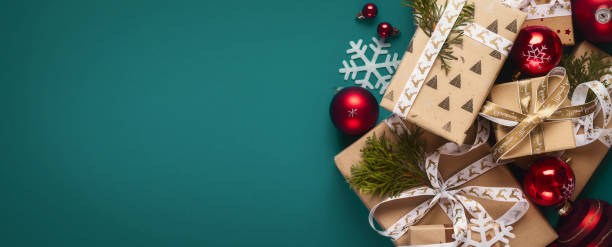 istock Gift boxes with bows and Christmas red balls top view 1711261142